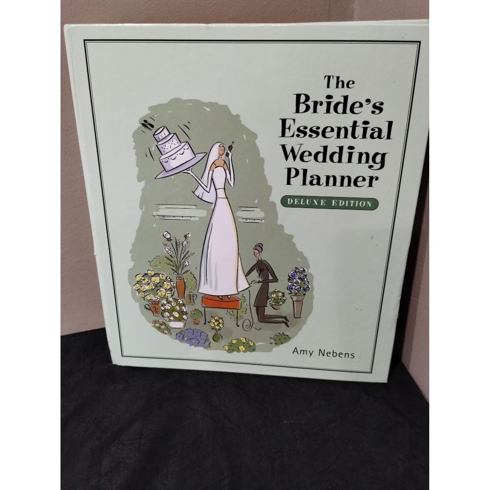 The Bride's Essential Wedding Planner Deluxe Edition. Like new condition. Unused